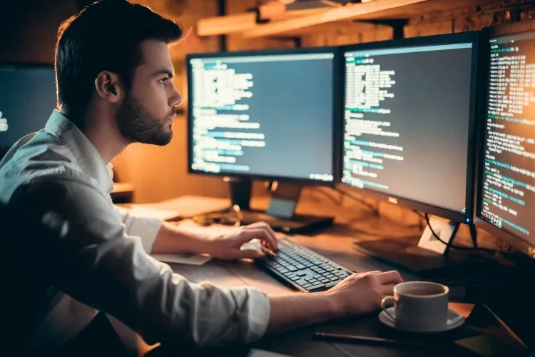 men coding on a computer develop